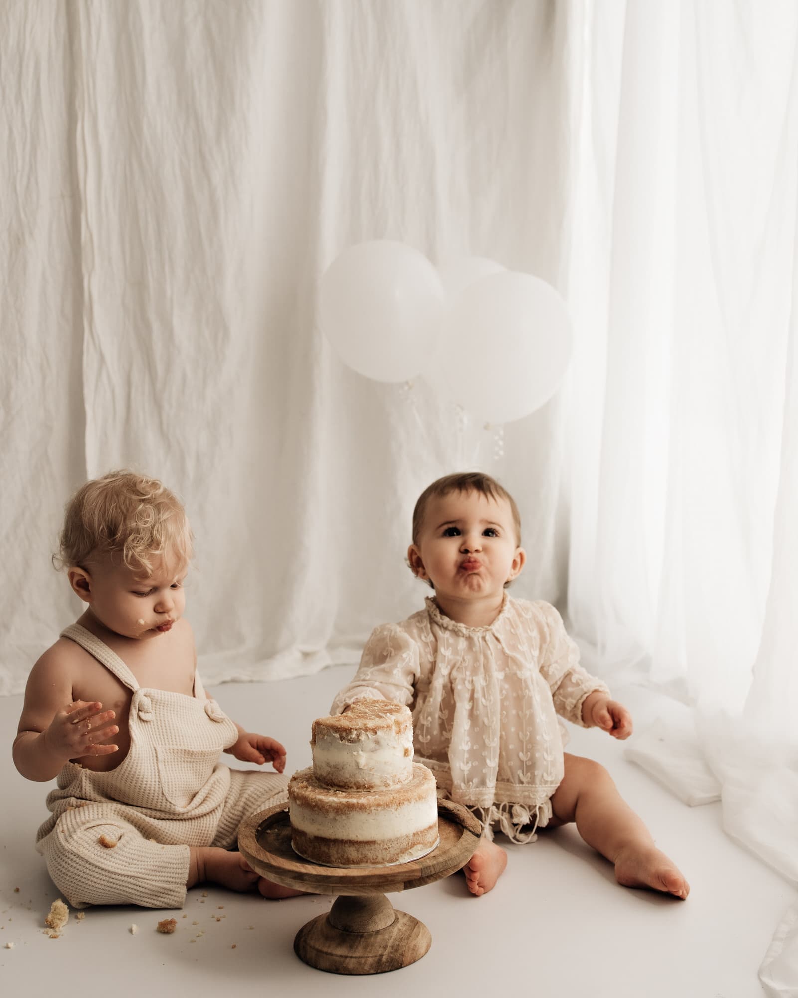 twins eating cake during a bradford cake smash photographer photoshoot