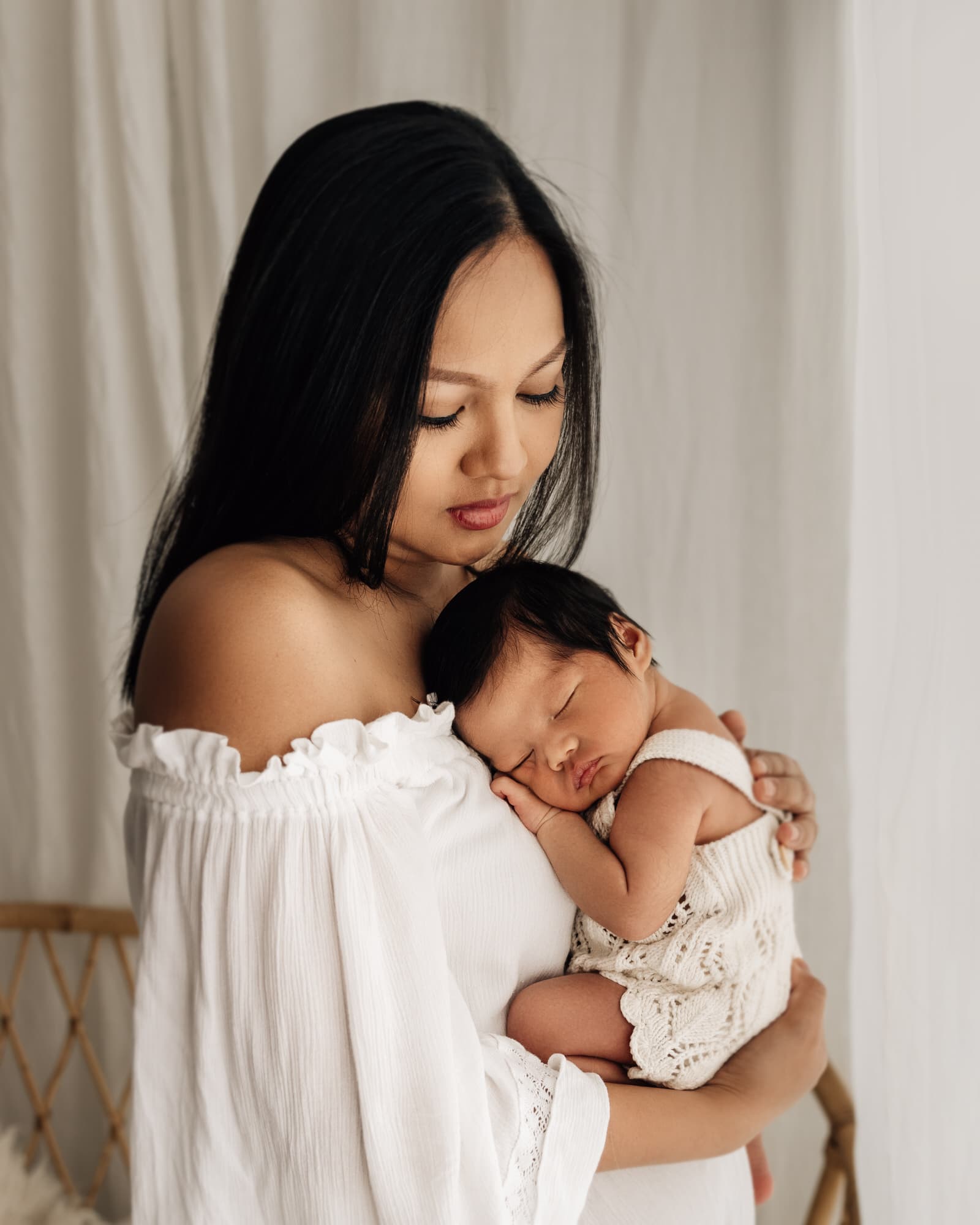  mother holding baby during a leeds newborn potographer photoshoot